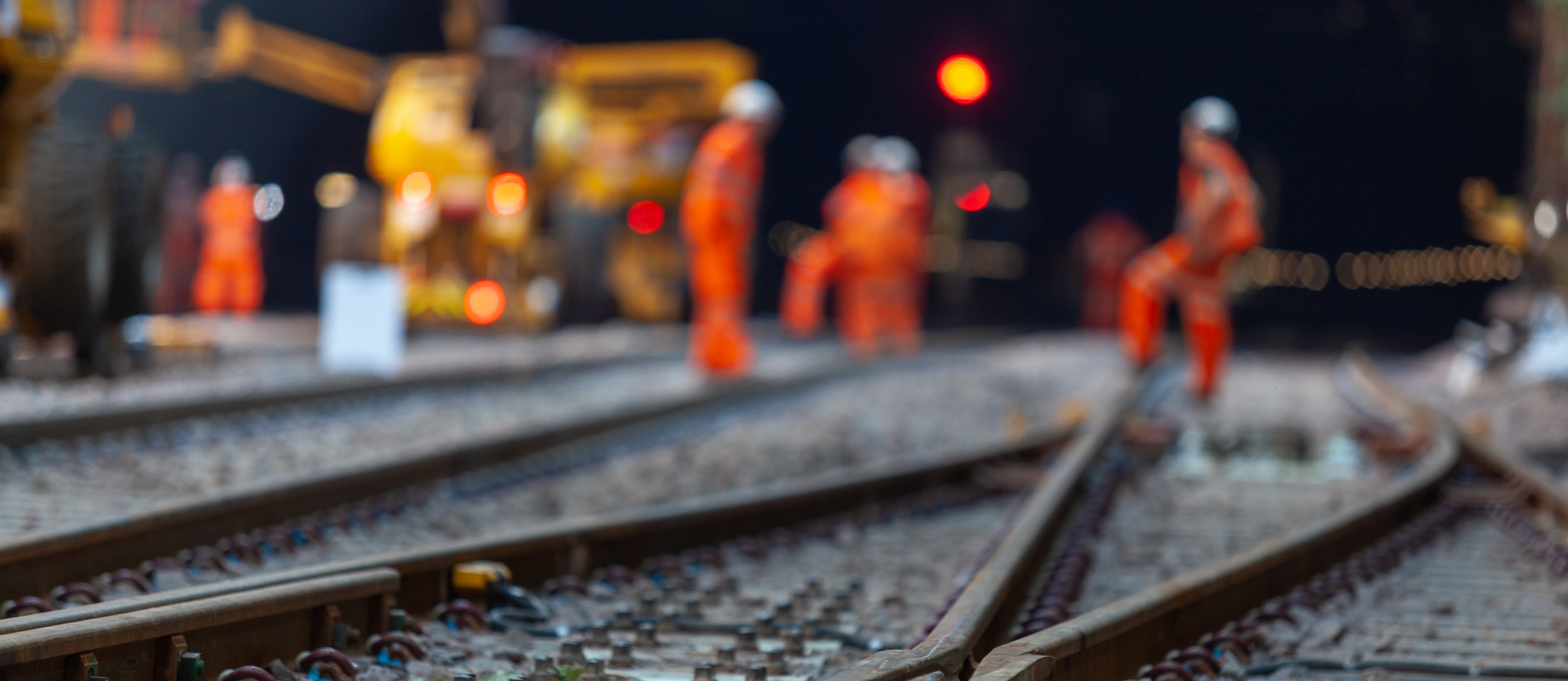 rail workers on track