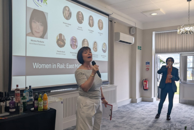 Woman standing in front of a presentation 